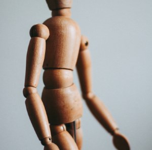 wooden doll illustrates value of chiropractic manipulation